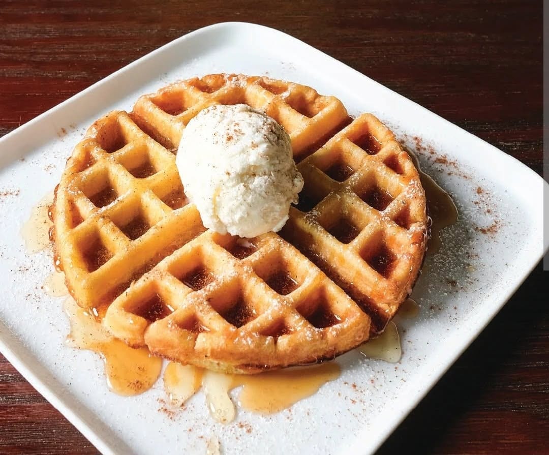 A Belgian waffle topped with a scoop of Hershey's ice cream, syrup, and cinnamon at The Coney Island in Pottsville, PA.
